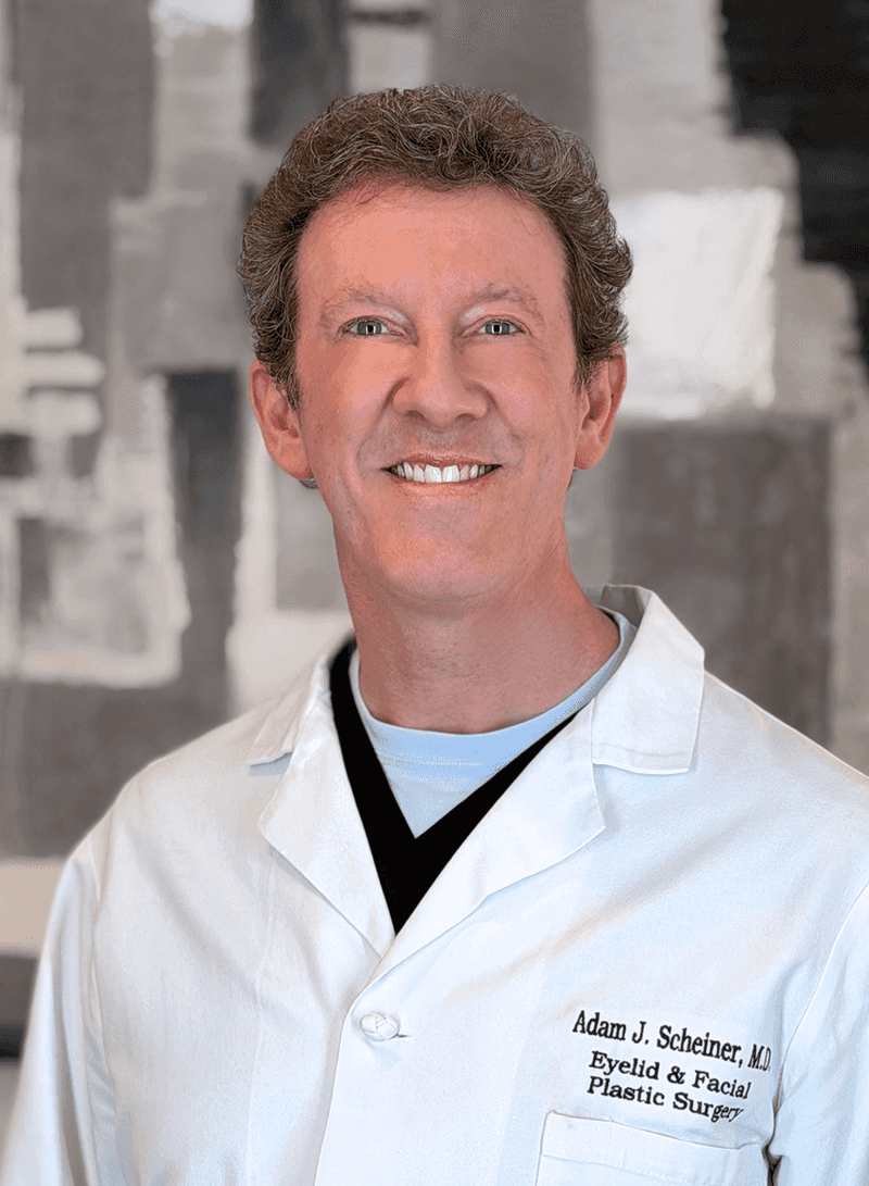 Dr. Adam Scheiner in a white dr coat.