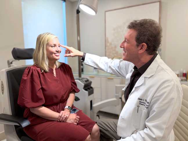 Dr. Scheiner consulting with a patient.