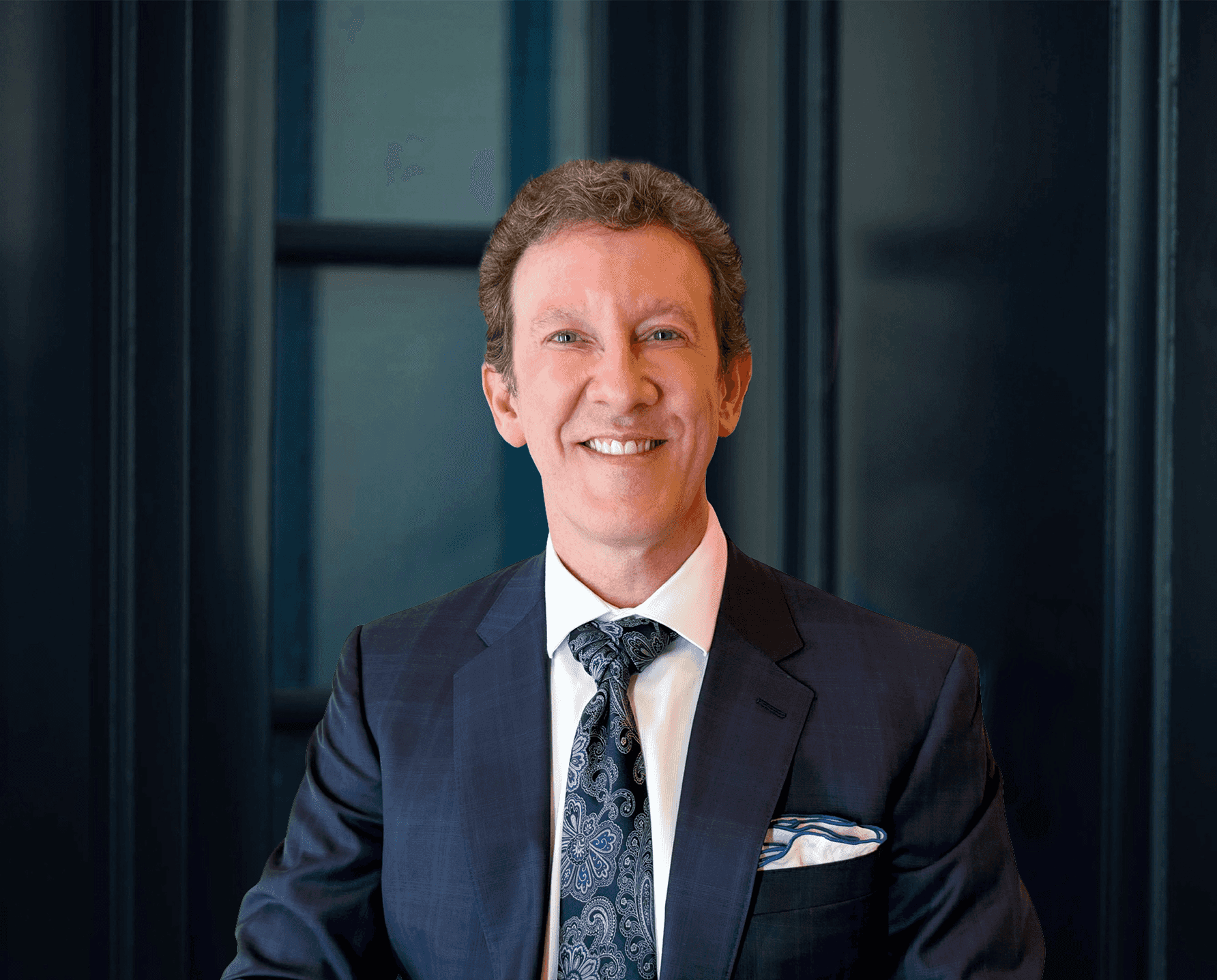 Dr. Adam Scheiner in a blue suit and tie.